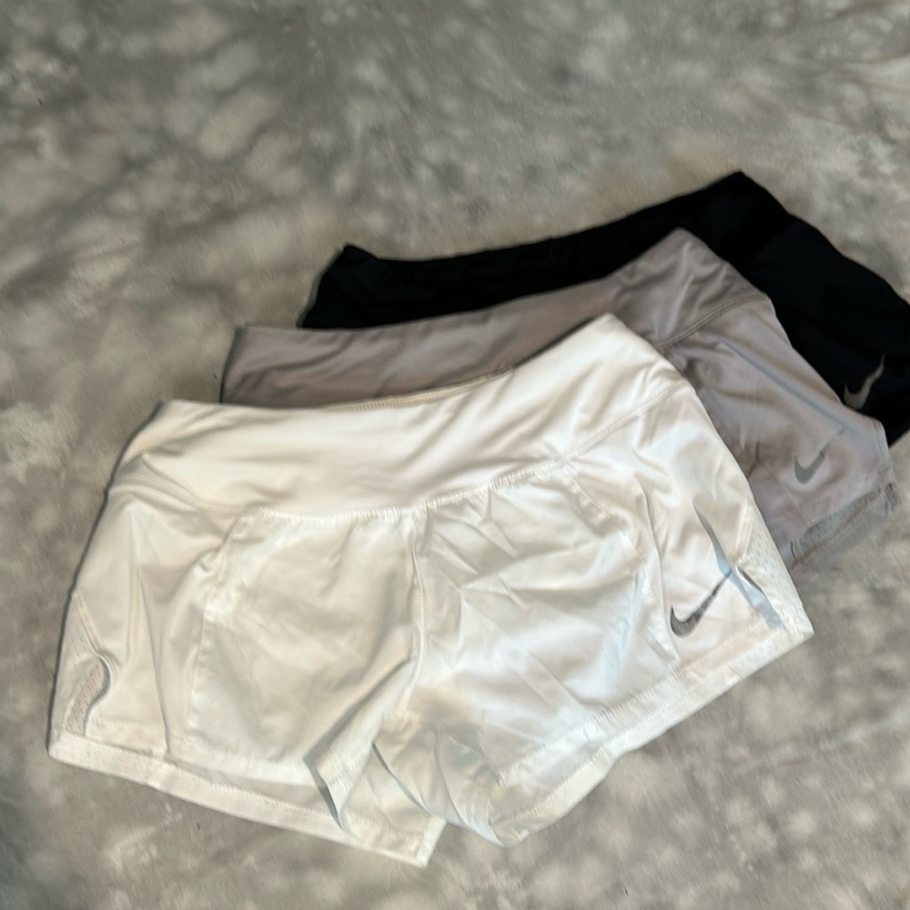 Women’s Nike Dri Fit 2” shorts.  Lot of 3.  Size Small.  White, Grey and Black.